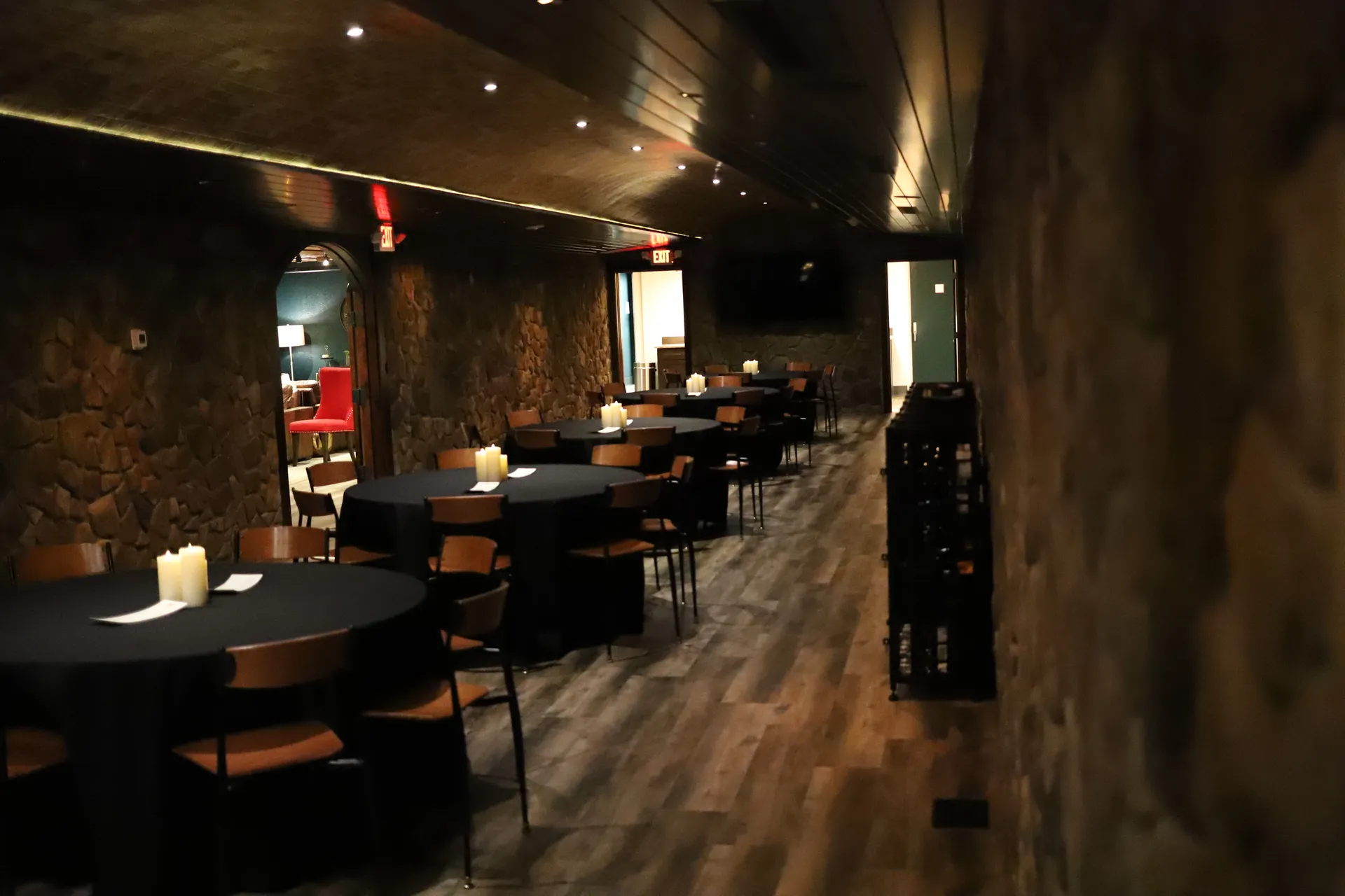 Bella Vino event room with tables and stone archway